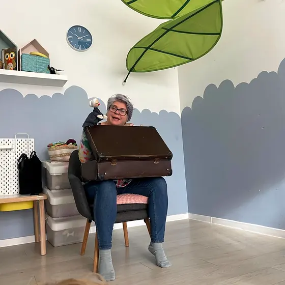 A granny puppet tells a story